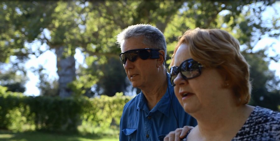 Terry Byland, who received a bionic eye (Argus II retina prosthesis) walking with his wife Sue.