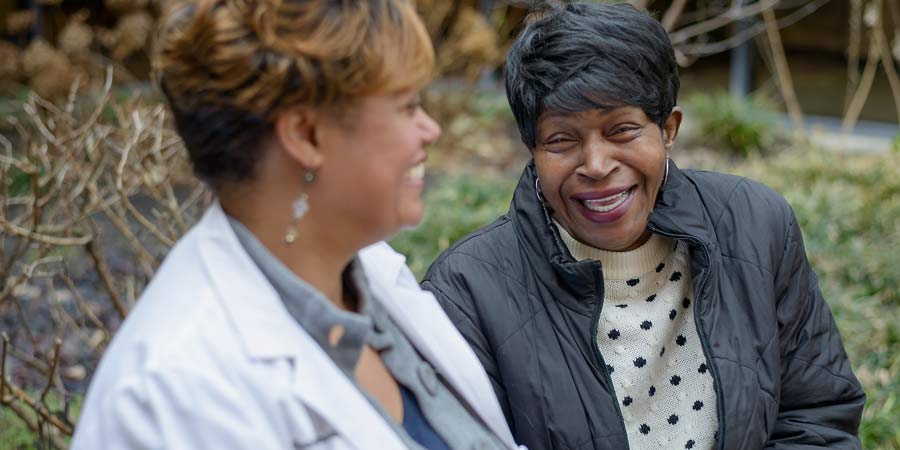 Peggy Wellman laughs with Dr. Chasidy Singleton, who saved Peggy's remaining vision from glaucoma.