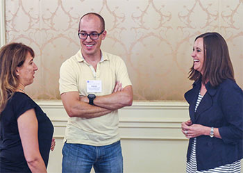 Courtney Bovee, MD (right), talks to fellow ophthalmologists Chris Albanis, MD, and Aaron Holtebeck, MD, during a recent state secretariat meeting.