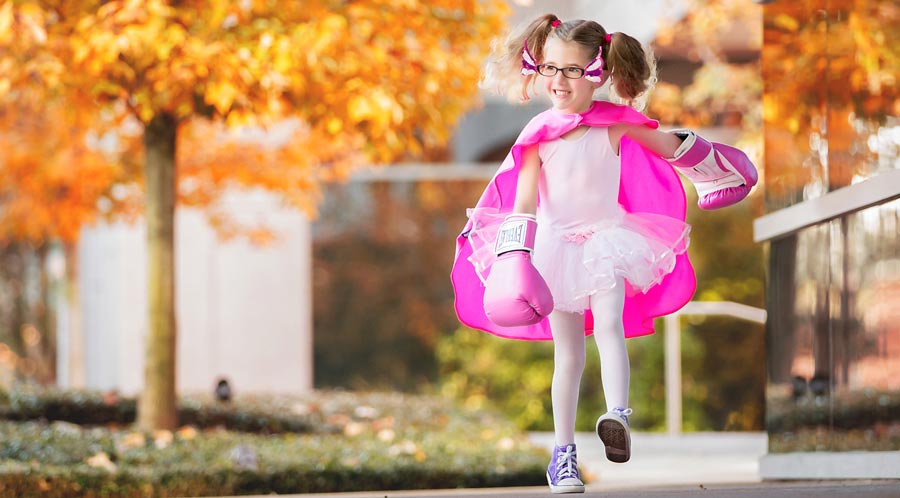 Callie outdoors in ballet outfit and pink boxing gloves