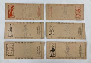 Six beige rectangular cards with images printed on them in red or blue ink. Each card also has a pencil drawing mimicking the ink images on the card. Images are either of clowns or rabbits.