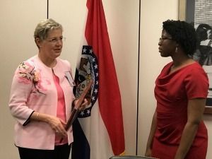 Academy President Cynthia A. Bradford, MD, left, presents a Visionary Award for Sen. Claire McKaskill, D-Mo., to the senator’s legislative counsel, Janelle McClure.