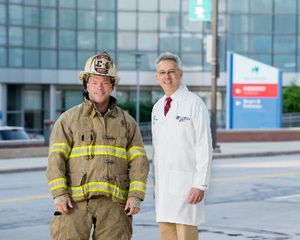 Firefighter Jay Northup with his ophthalmologist Dr. Thomas Steinemann.