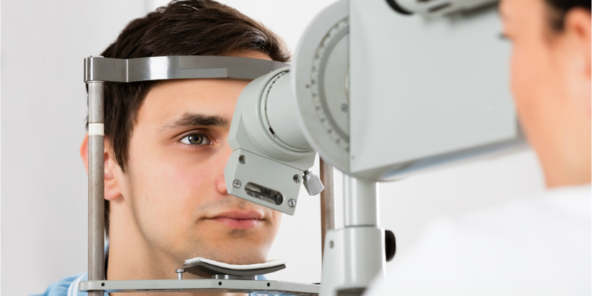 An ophthalmologist examines a patient's eyes.