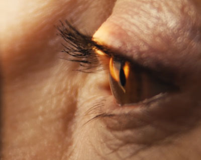 Closeup of eye being examined with new technology for detecting early Alzheimer's.