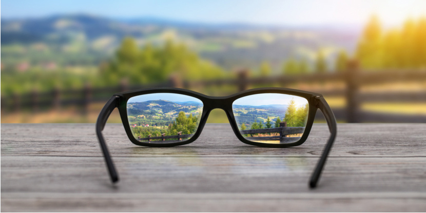 Glasses bring a blurry distance view into focus for a person with nearsightedness, or myopia.