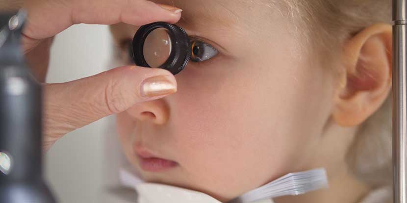 Young girl having her eye examined