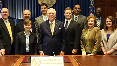 Emory and Augusta university residents join Georgia Society of Ophthalmology at the Georgia Capitol meeting with Governor Nathan Deal (center). Morgan Micheletti, MD pictured right of Gov. Deal.