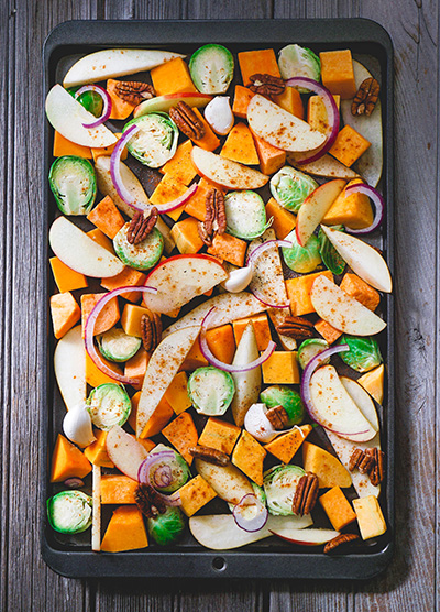 Colorful, chopped vegetables in a roasting pan