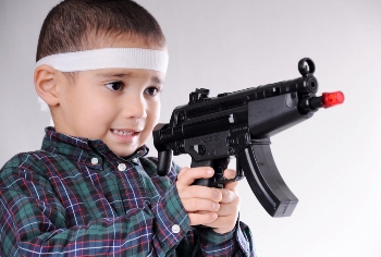 Boy holding toy gun