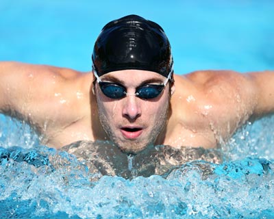 Photograph of a person wearing goggles while swimming