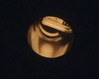 Light fixture seen through fake eclipse glasses