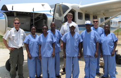 Dr. Cropsey with some of his staff, prior to a surgical safari to Lake Tanganyika, Tanzania, by airplane and then helicopter.