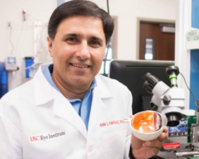 Dr. Humayun in his lab with the Argus II retinal prosthesis.