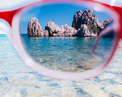 Pretty ocean view with glare seen through a polarized sunglass lens