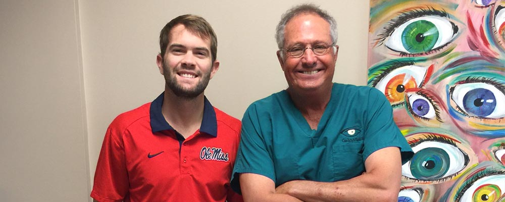 Nick Myer with Gene Gaddy, MD, who performed an eye exam that led to a leukemia diagnosis.