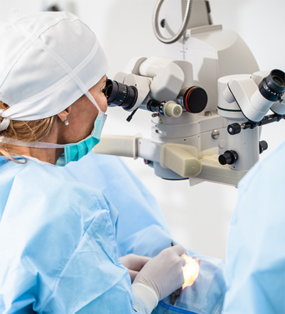Ophthalmologist performs surgery with an operating microscope