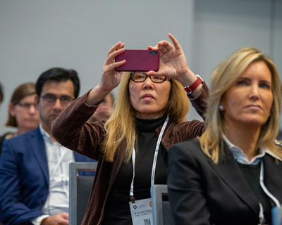 Attendee taking a photo at AAO 2019.