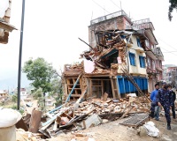 Rescue workers near a collapsed house in Nepal after the April 25 earthquake