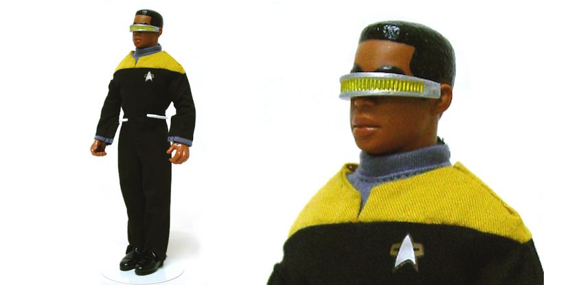Two photographs of an action figure of the Star Trek character Geordi LaForge. The action figure is about six inches tall, and he is a black man with short cropped hair. He wears a silver and gold band across both of his eyes. He is wearing a black and yellow uniform with a small silver logo pin. The action figure is being held by a white metal stand around the figure's waist.