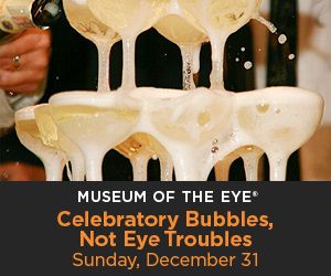 A hand from the side of the image pours a bottle of champagne into several stacked coupe glasses. There is a black bar at the bottom of the image with orange and white lettering that reads: Museum of the Eye Celebratory Bubbles, Not Eye Troubles Sunday, December 31.