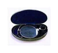 A pair of eyeglass lenses folded in half sit in a case with blue velvet lining.
